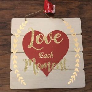 “Love each moment” hanging wall sign